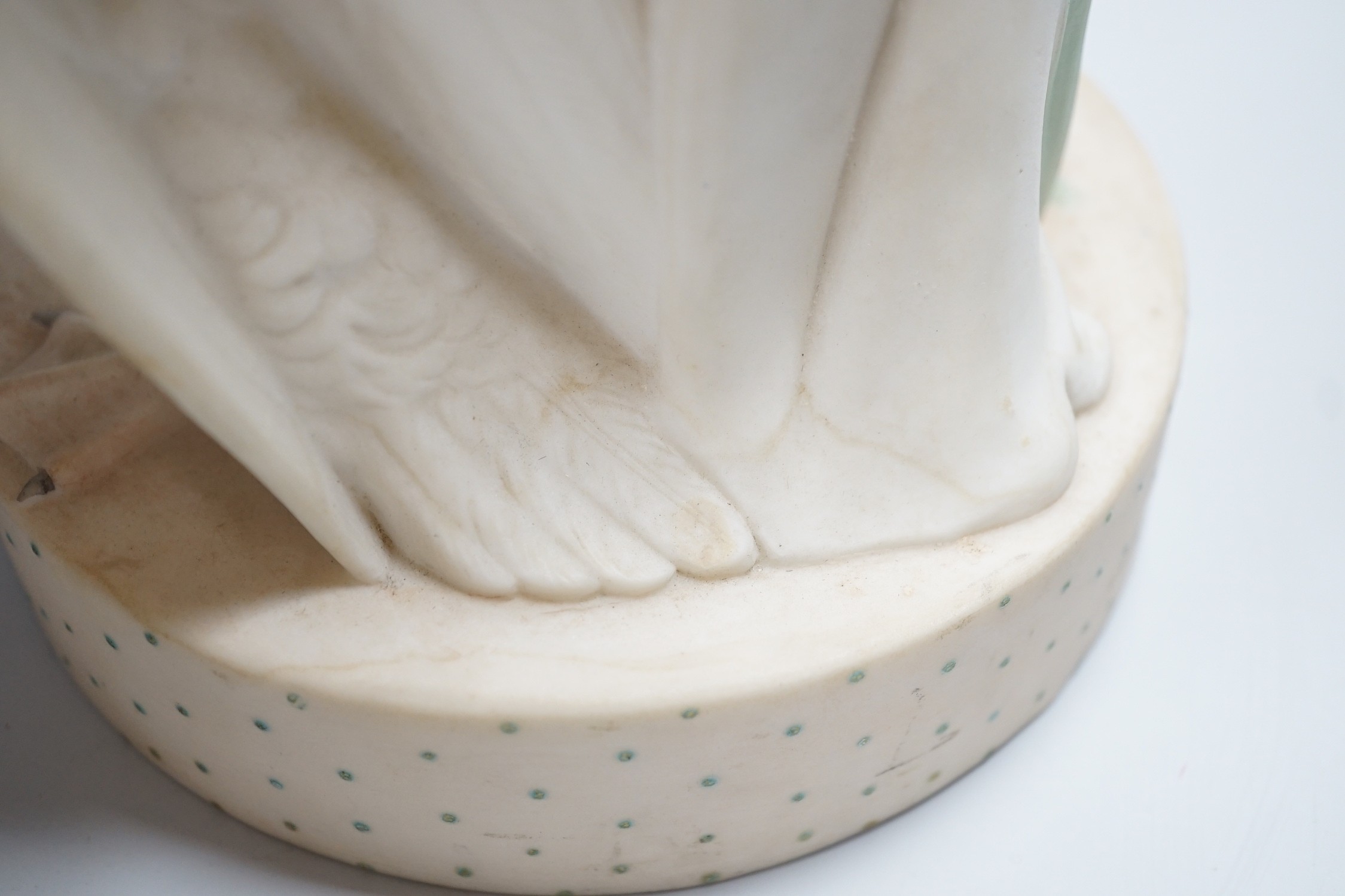 A pair of large W H Goss bisque classical female figures, one with lamb, the other Leda and the Swan, 45cm